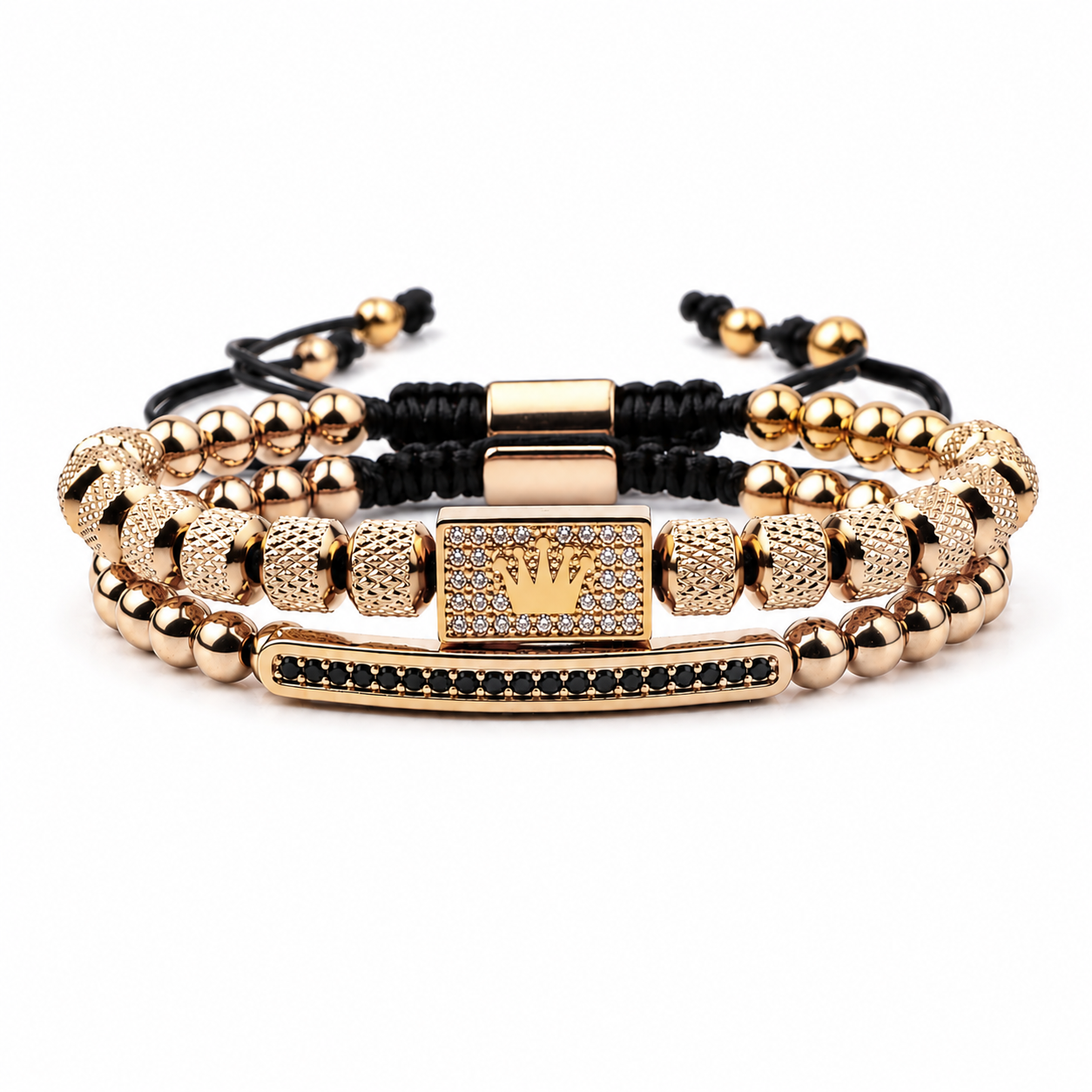 Gold and black beaded bracelets with a crown charm on a white background. Exokeleton Royale Bracelet
