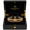 Gold bracelet in a black Exoskeleton Watches box