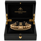 Gold bracelet in a black Exoskeleton Watches box